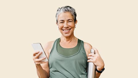 woman holding phone and water bottle