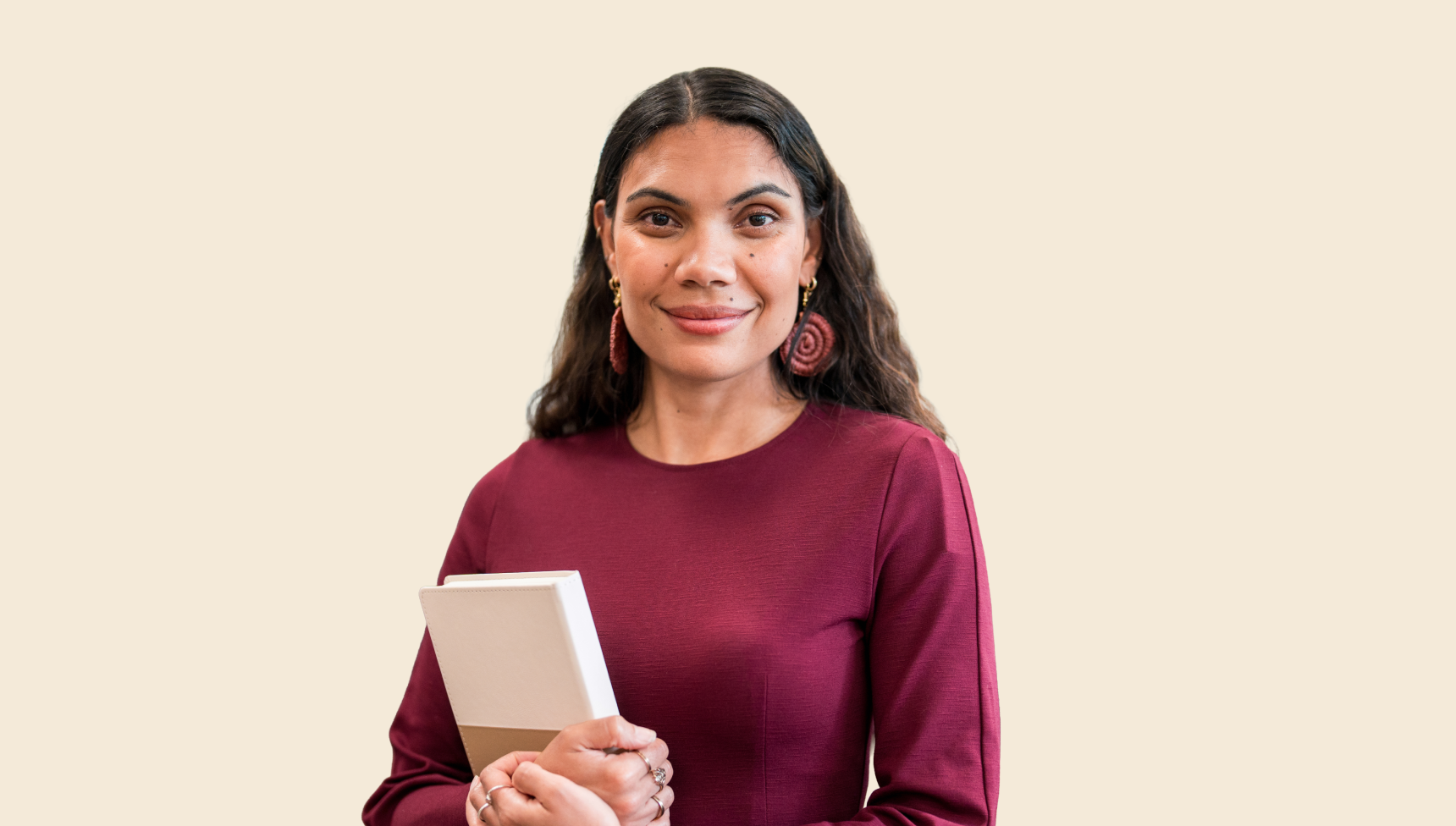 smiling woman wearing maroon top
