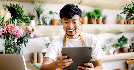 Garden nursery staff looking at a tablet