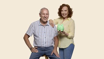 couple holding a piggy bank