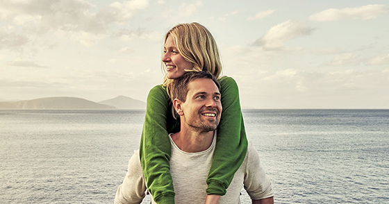 couple in front of ocean