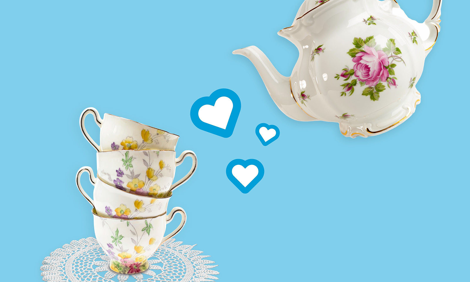 Teapot pouring love hearts into teacups