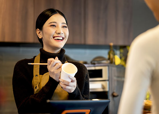 woman taking a coffee order