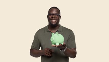 Man holding piggy bank