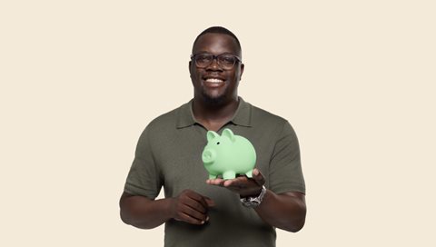 Man holding piggy bank