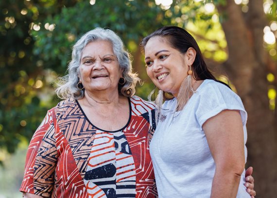 Two First Nations women hugging
