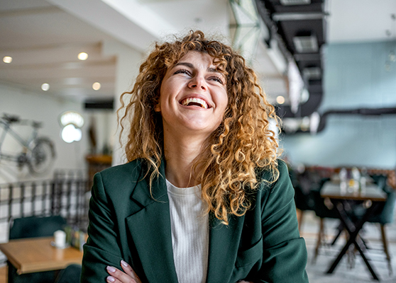 Smiling woman green jacket