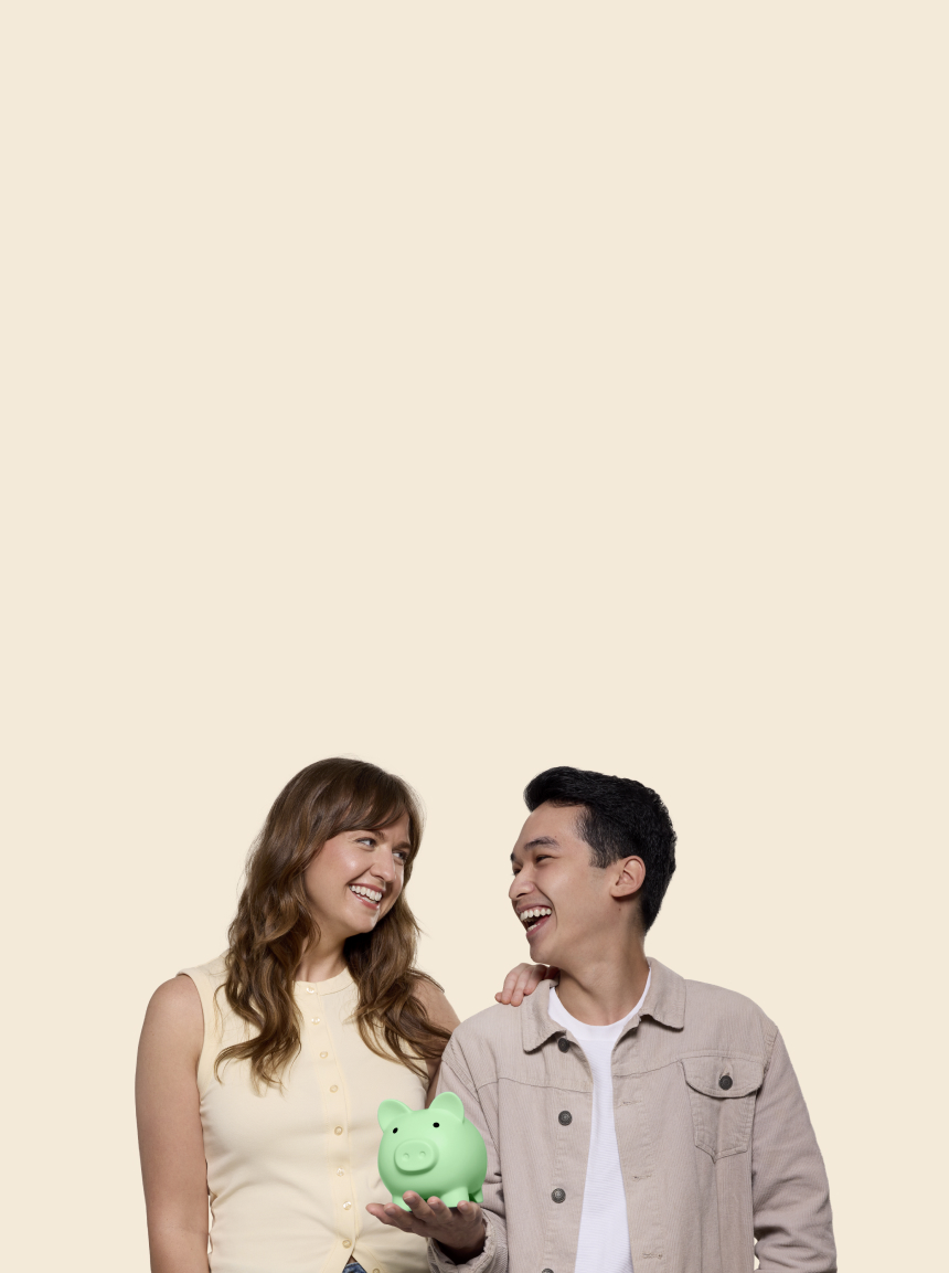 Rest members Caitlin and Carlos holding a green piggy bank