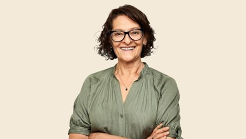 smiling woman in olive green shirt