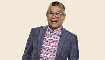 man smiling wearing blazer