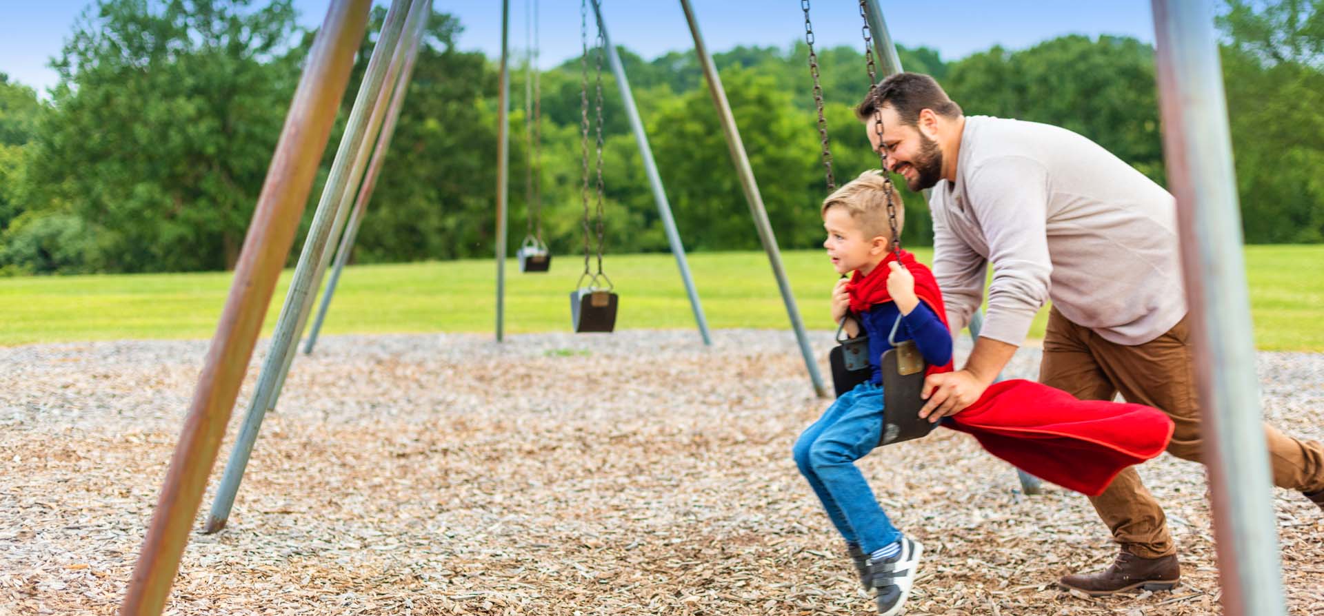 father and son on swing