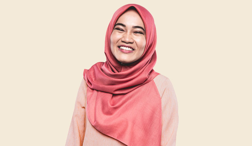 woman smiling wearing headscarf