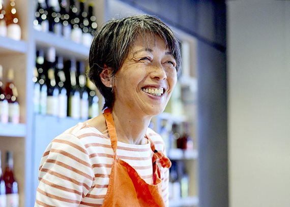 woman with apron smiling