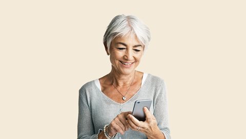 Older woman looking at her mobile phone