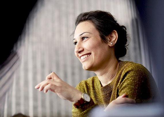 corporate woman in yellow sweater